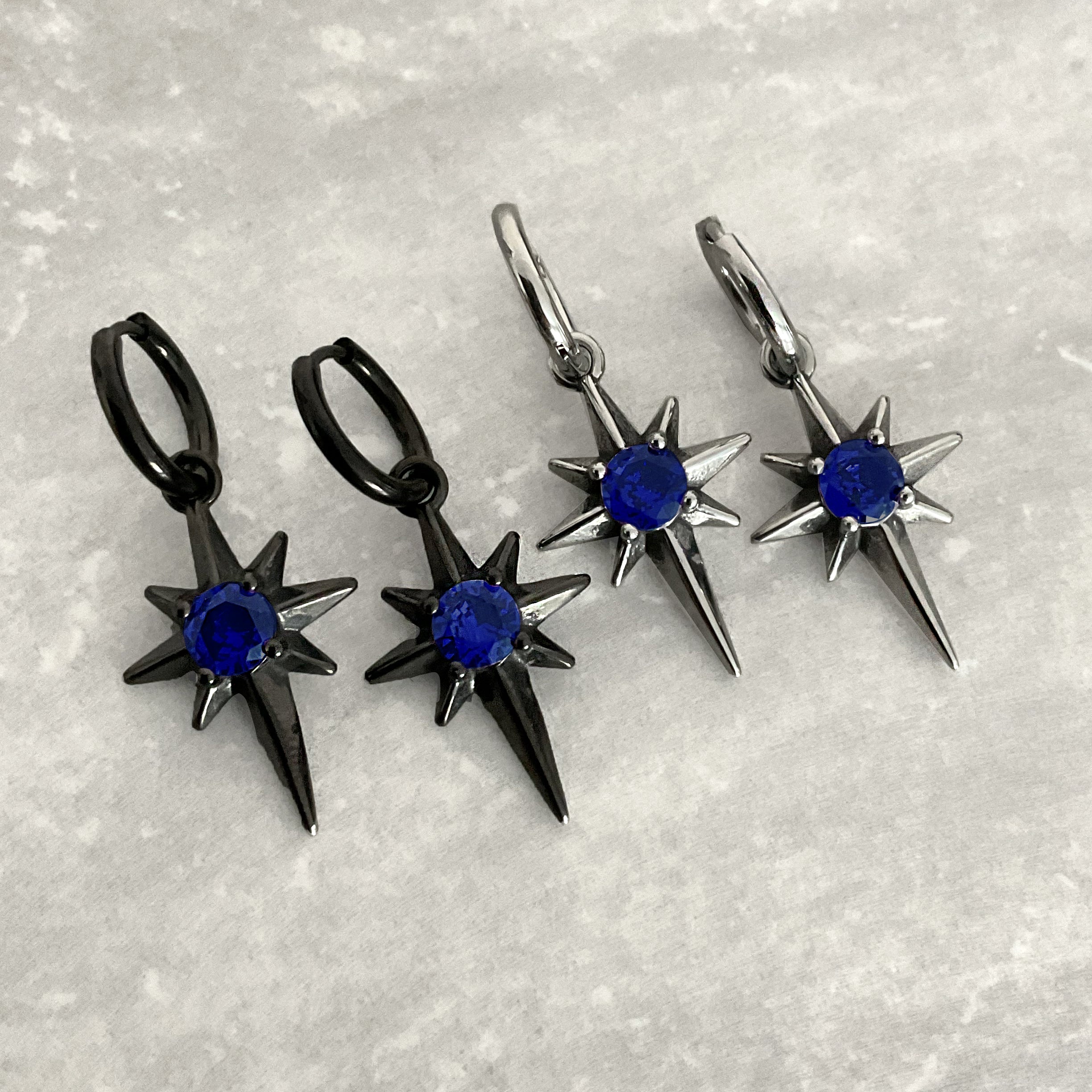 NORTH STAR HOOP EARRINGS WITH PURPLE CZ
